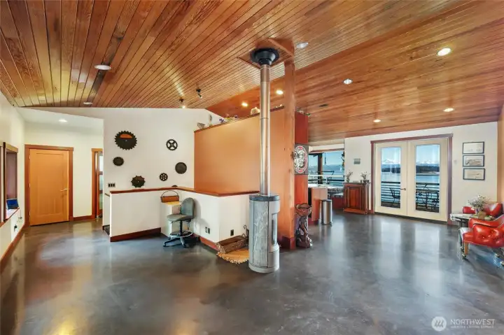 The free standing, high efficiency wood stove adds extra heat to the main level, as there is radiant heated floors throughout. The free standing, high efficiency wood stove adds extra heat to the main level, as there is radiant heated floors throughout.