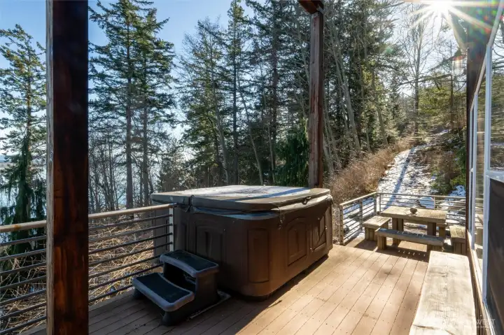 The hot tub does remain with the sale of this home and is privately situated with all the incredible views! The hot tub does remain with the sale of this home and is privately situated with all the incredible views!