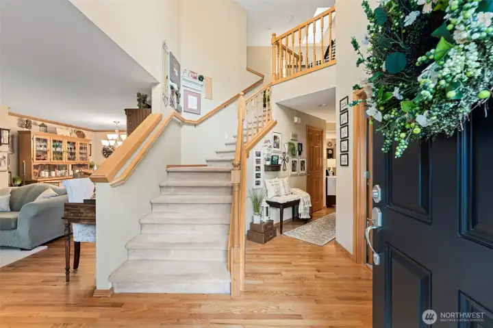 Grand two-story foyer with vaulted ceilings & refinished hardwood floors throughout the main level.