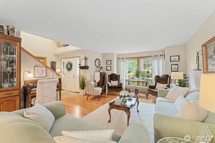 Large formal living room filled with natural light.