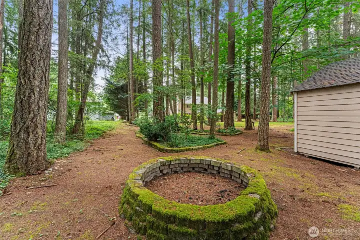 Enjoy evenings around the fire pit in your private, park-like backyard!