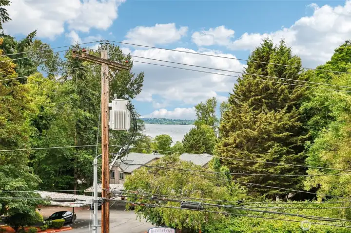 Community exterior framed by mature greenery.