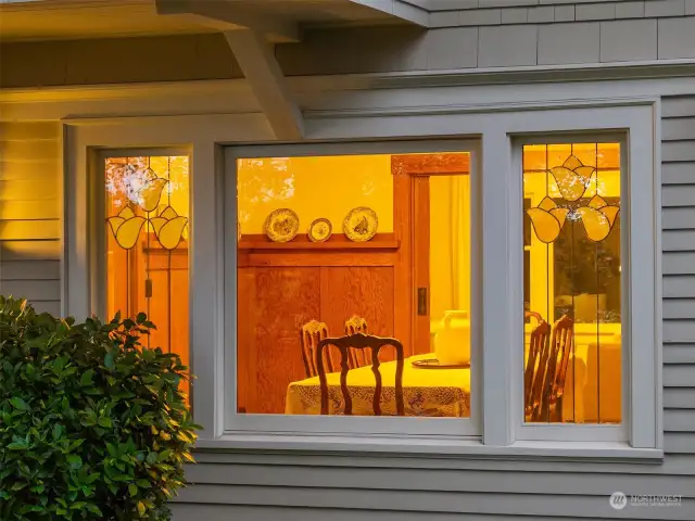 Looking in the dining room from the garden. Details of the Art Deco stained windows.