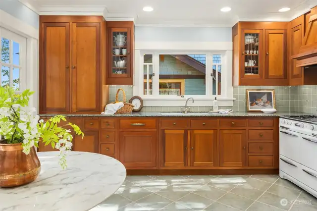 Granite countertops, built-in pantry + china cabinetry: a kitchen designed for the most demanding cooks and perfect for entertaining. The restoration was done to maximize space and storage with durability in mind using high quality cherry custom cabinetry. The room flows perfectly with the rest of the house and its period details.