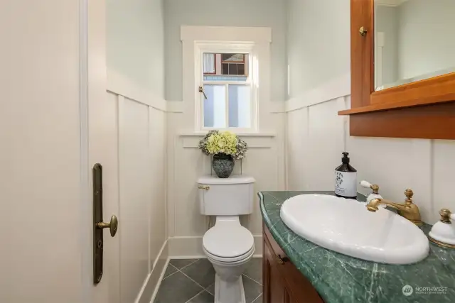 Half bath next to the kitchen flows with the kitchen coloring and finishes. Note that all remodeled products are using real wood (no MDF in the house).