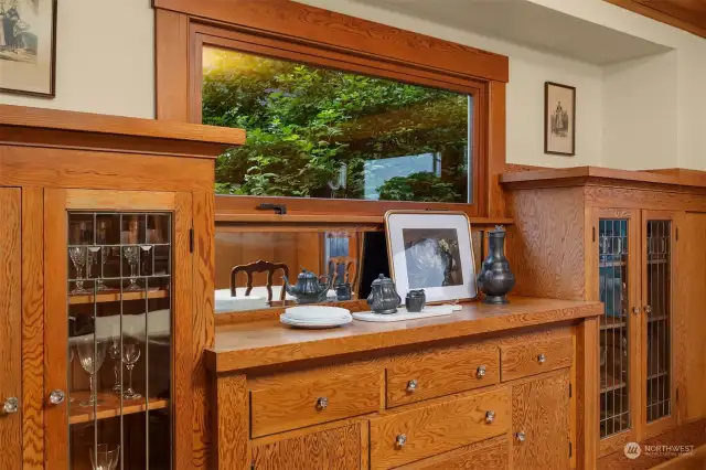 The perfect built-ins for china, glass, silverware and tablecloths are original to the home with its crystal knobs and beautiful leaded glass doors.