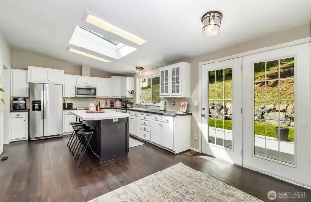 French Style Doors Lead to a Newer Poured Concrete Patio~