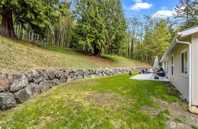 Solid Rock Retaining Wall Provides a Nice Separation Between the Upper & Lower Portions of the Parcel~