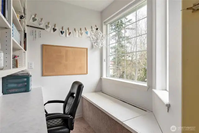 Bedroom #2 built-in desk with shelves & window seat.