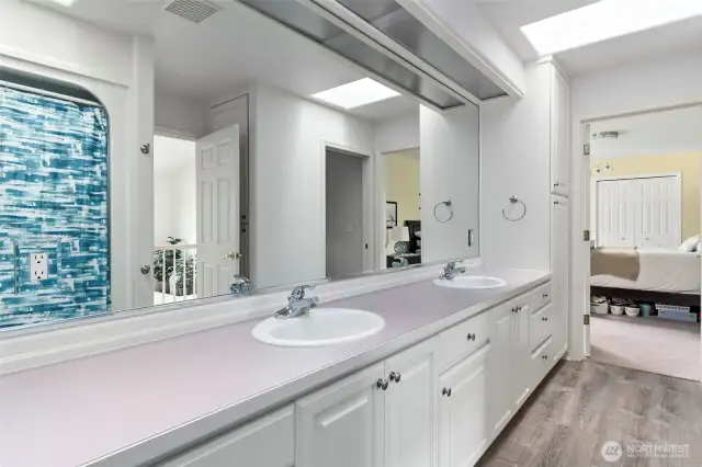 Jack-N-Jill Bathroom between Bedroom #2 & #3 offers a dual vanity and tub/shower.