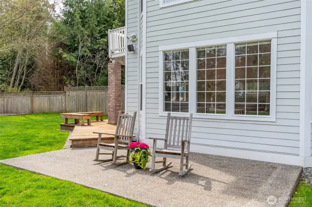 Enjoy outdoor entertaining on the large deck/patio overlooking this estate sized lot!