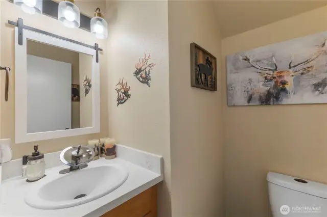 Half bath located just inside of the garage entry.