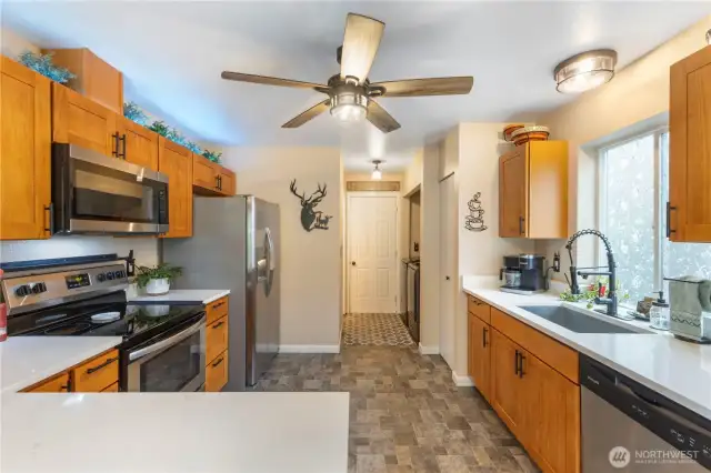 Spacious kitchen with SS appliances that all stay.