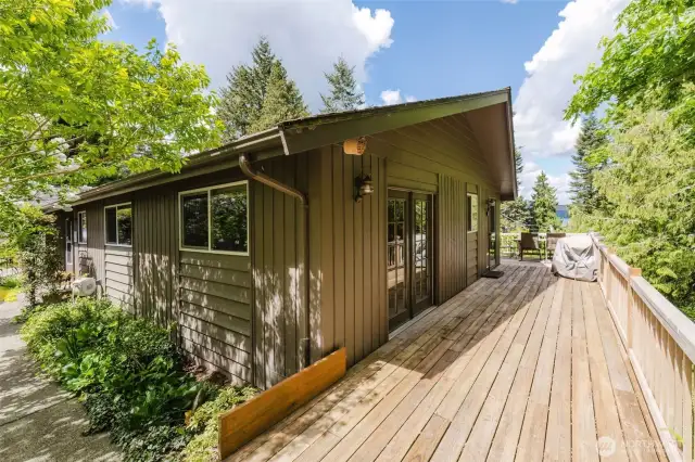 The North end of the deck provides access to the utility room and Primary bedroom.