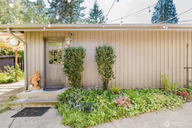 Oversized two-car garage with storage and work space.