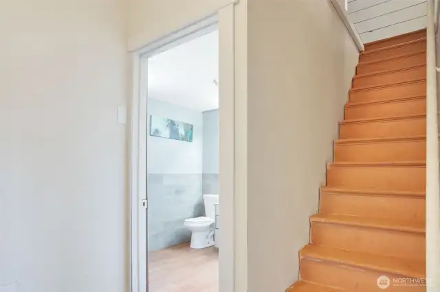 Stairs, bathroom on the left