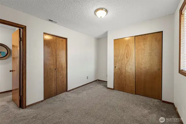 The second bedroom offers great functionality with not one, but two closets—providing ample storage space for clothing, linens, or personal items.