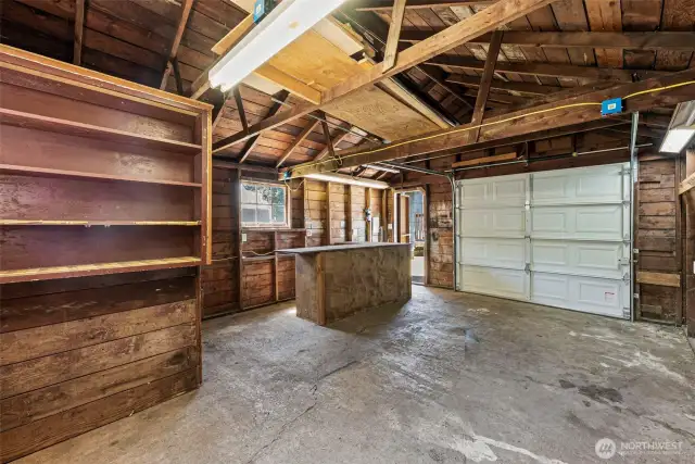 The detached garage includes a built-in bar area that adds a fun and functional touch to the space. Whether you’re entertaining friends, setting up a workshop refreshment station, or using it as a practical workbench area, this versatile feature enhances the garage’s charm and usability.