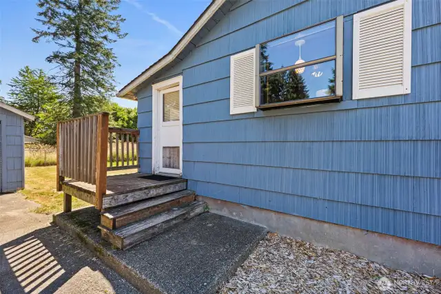 A convenient door leads to the mudroom, providing easy access to both the detached garage and the spacious yard.