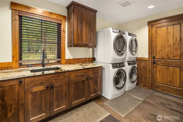 Mudroom with Dual Electrolux Washer & Dryer off Garage Entry. Oversized storage Closet & Built-In Coat & Shoe Storage