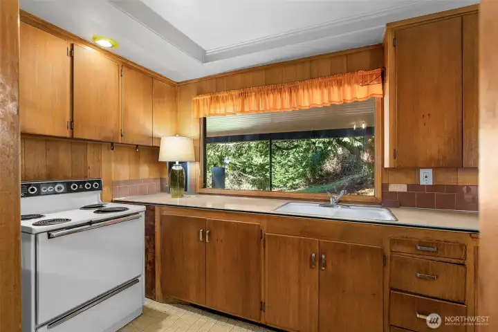 Kitchen Looking out to the yard and covered walkway.