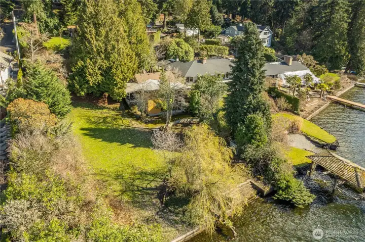 Rare ½-acre Lake Washington lot featuring 110 feet of low-bank waterfront and generous dimensions for building a luxury custom home.