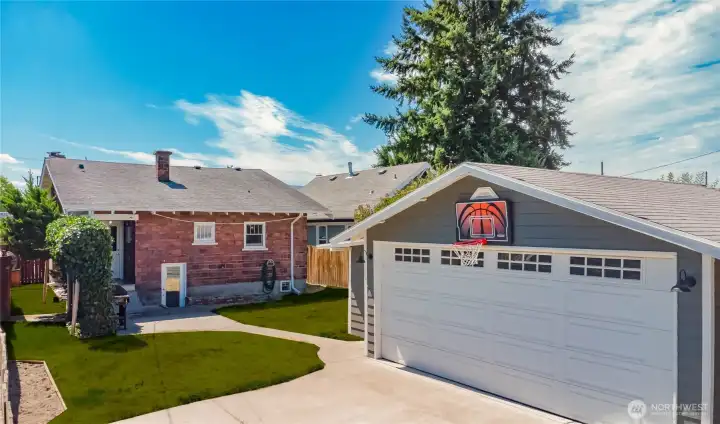 Your backyard retreat in the heart of the city offers versatility that no other property can offer. (Grass is photo enhanced to green)