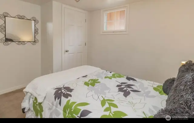 Basement bedroom #2 with closet featured here