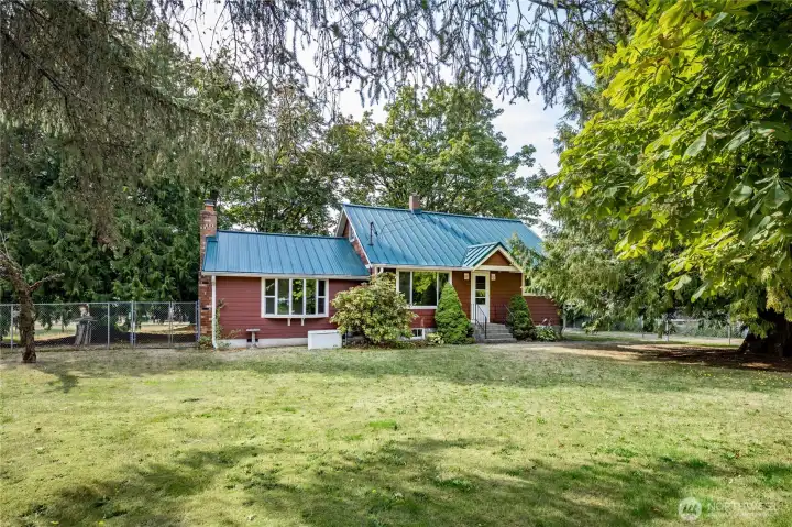 House has been updated with a metal roof, Hardie Plank siding (with baked-in color!), triple-pane windows, updated plumbing and updated electrical panel & wiring.