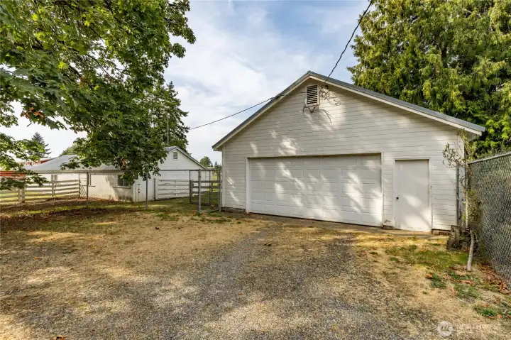 Detached 5-car garage has a huge shop on the back side