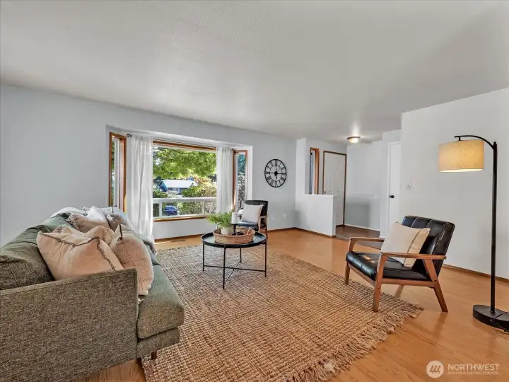 View of bay window shaded by maple tree