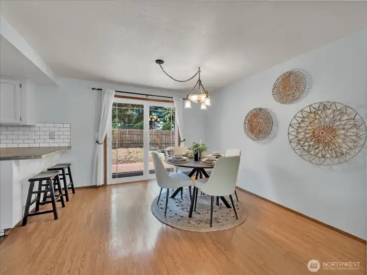 Follow the living room over to the dining room that faces the kitchen and is complete with slider to deck and patio area