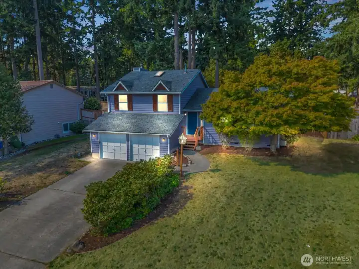 Twilight view of the home, look how cute this purple house is!