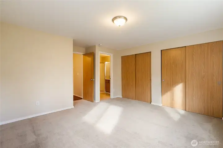 Primary Bedroom with brand new carpet and en suite bathroom