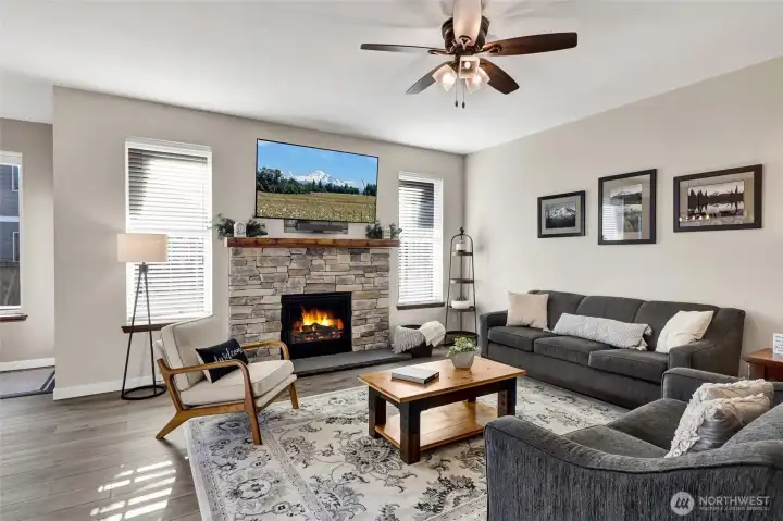 A newly installed gas fireplace serves as the heart of the room, adding warmth and style while grounding the space for everyday living and entertaining alike.