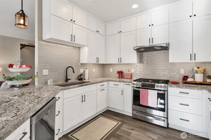 Full-height cabinetry draws the eye upward, creating a refined, custom-finished kitchen.