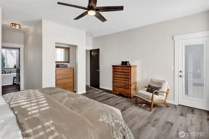 Additional touches in the primary suite include a niche for the chest and a ceiling fan.