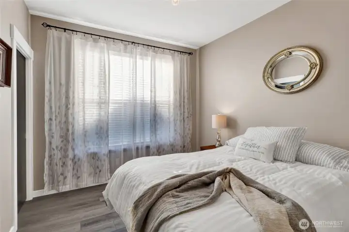 Bedroom 3 overlooks the back yard & includes a walk in closet.