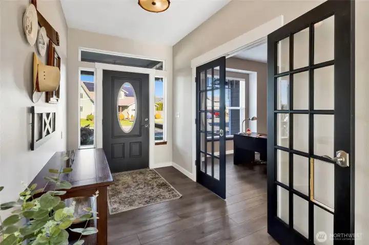 Yes, there is a den! The foyer offers access to the den/office through glass French doors.