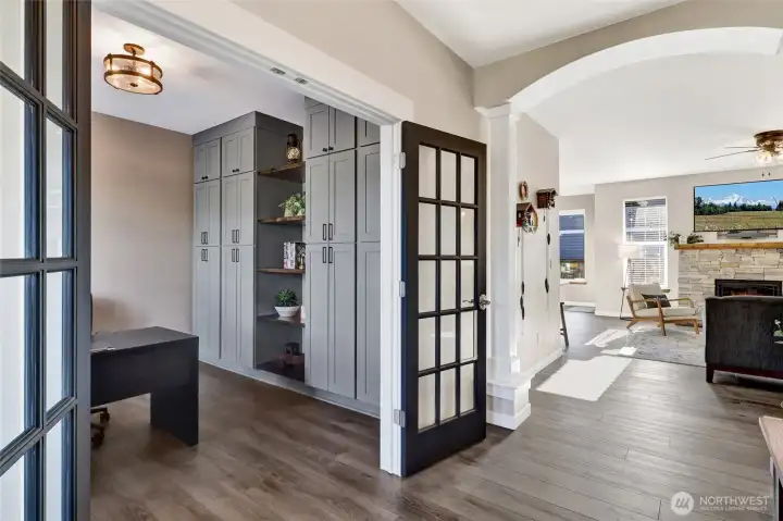 So many architectural features enhance this home, note the built ins in the den.