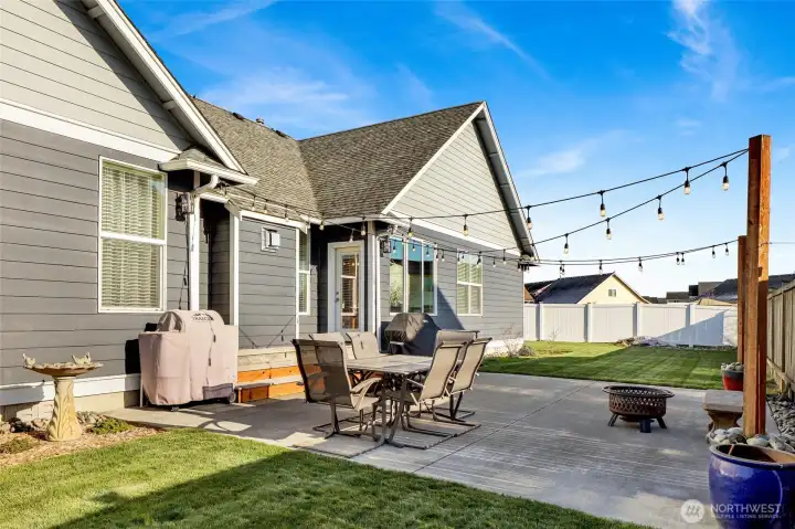 The enlarged patio space is enhanced with custom lighting.