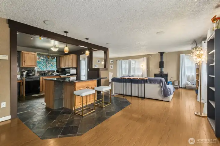 A connected living space where the kitchen, nook, dining room, and living room flow together with ease—ideal for gathering, entertaining, and comfortable day-to-day living.