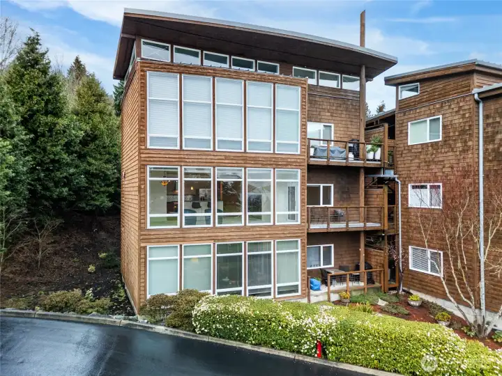 2nd floor unit with wall of windows and right sized balcony to view the mountains