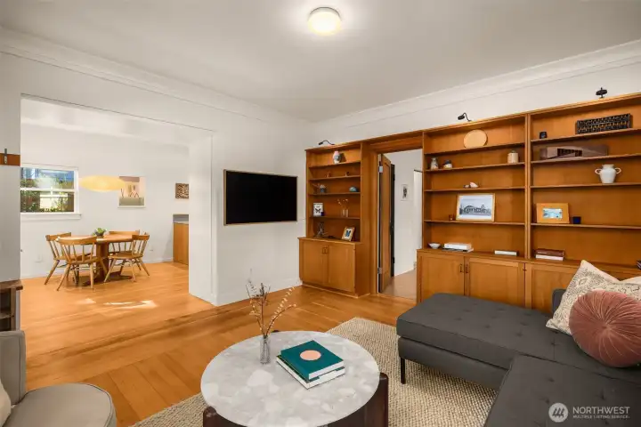 Living Room features refinished Fir wood floors, custom fir built-ins and a mini split for heating and cooling comfort.