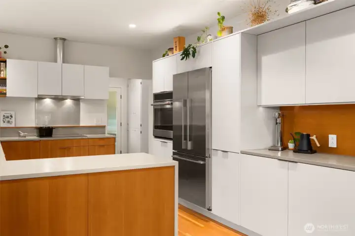 Kitchen features: Induction cooking, dedicated coffee bark, custom cabinetry and new Fir floors.