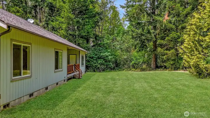 Large back yard surrounded by beautiful old growth to privately relax or entertain.