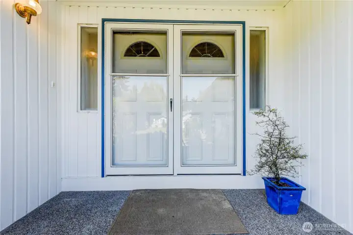 The covered front entrance keeps you out of the weather and the double doors welcomes you in.