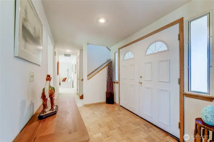 The spacious front entry welcomes you into the interior spaces of this lovely home.
