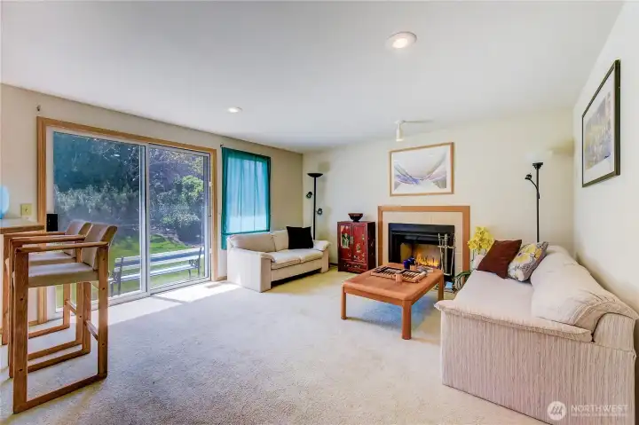 Here's the family room which opens out into the backyard.  Imaging reading a book sitting in front of the cozy fireplace on those cold winter evenings.  Backgammon anyone!