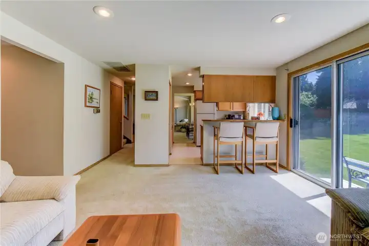 Here's the view from the family room into the kitchen.  You can see the dining room further down and then the living room.